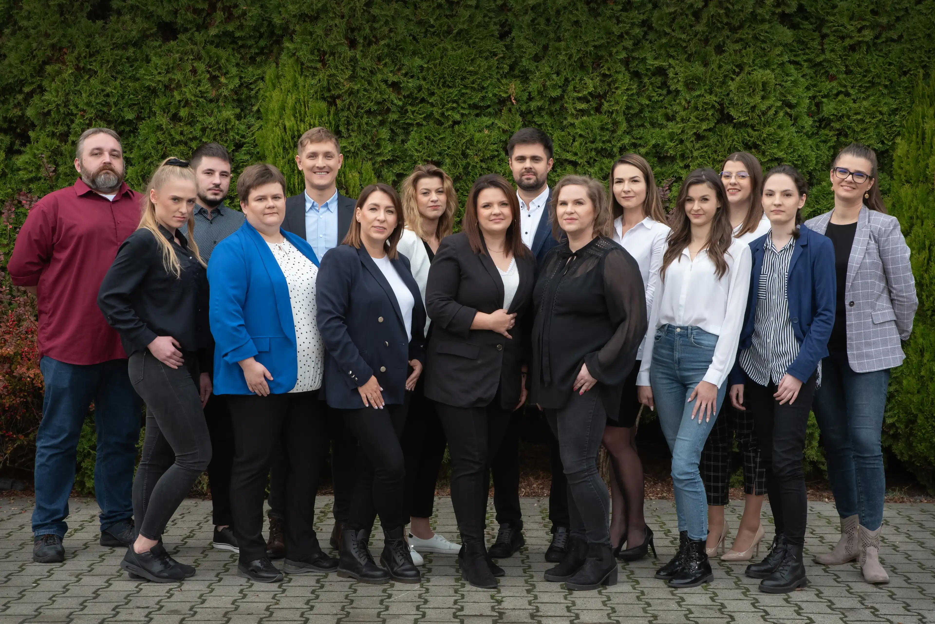 Most recent company IP employees photo in green trees background 